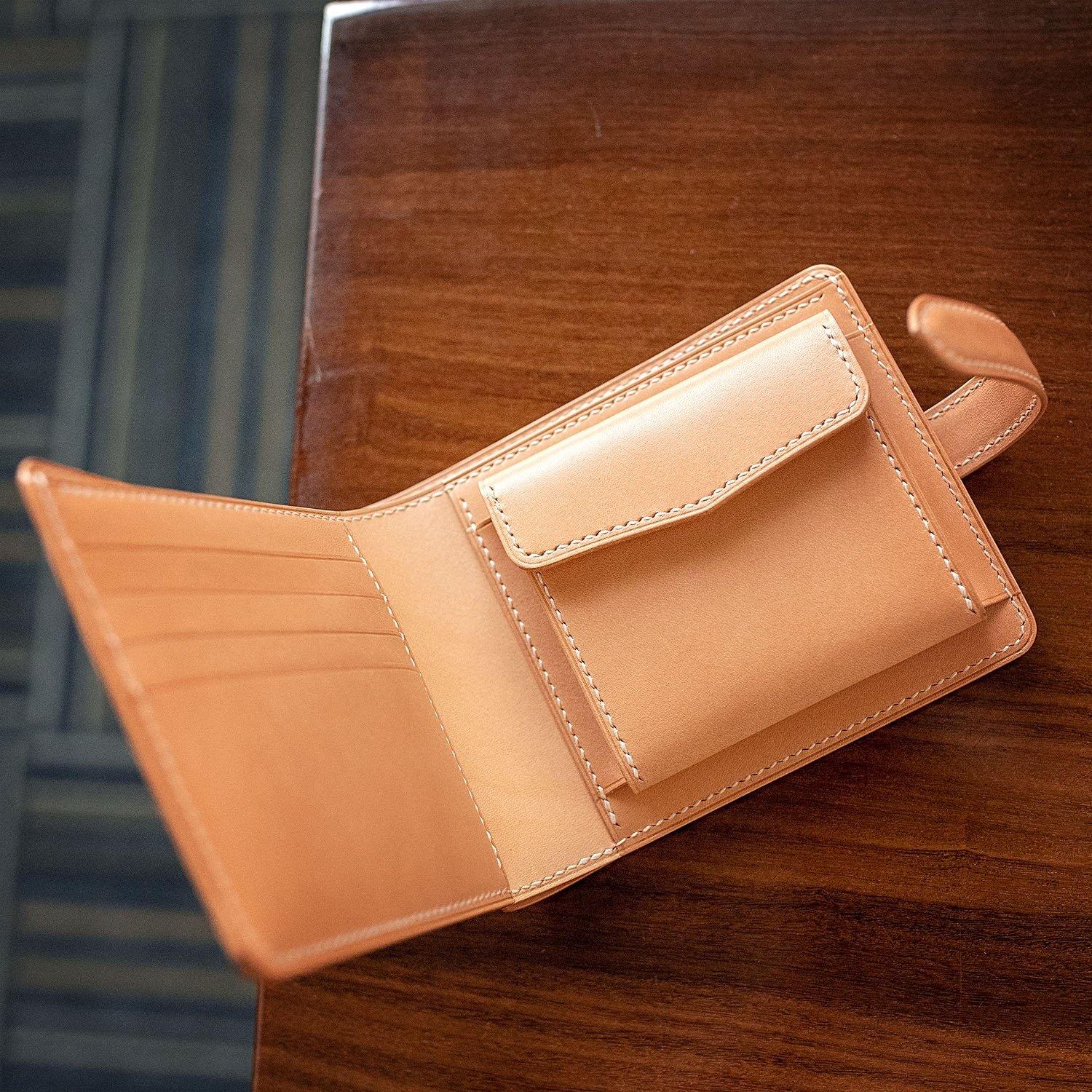 Leather wallet made of a vegetabe tanned leather for bills, buy cards and coins.